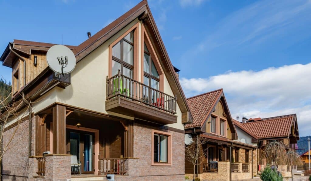 Modern houses with satellite dishes visible